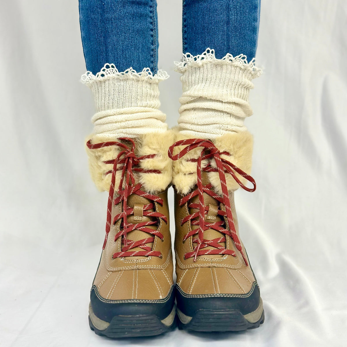 Beige winter boots with red laces worn with white socks and blue jeans on a white background, MOUNTAIN lace knee boot socks - natural