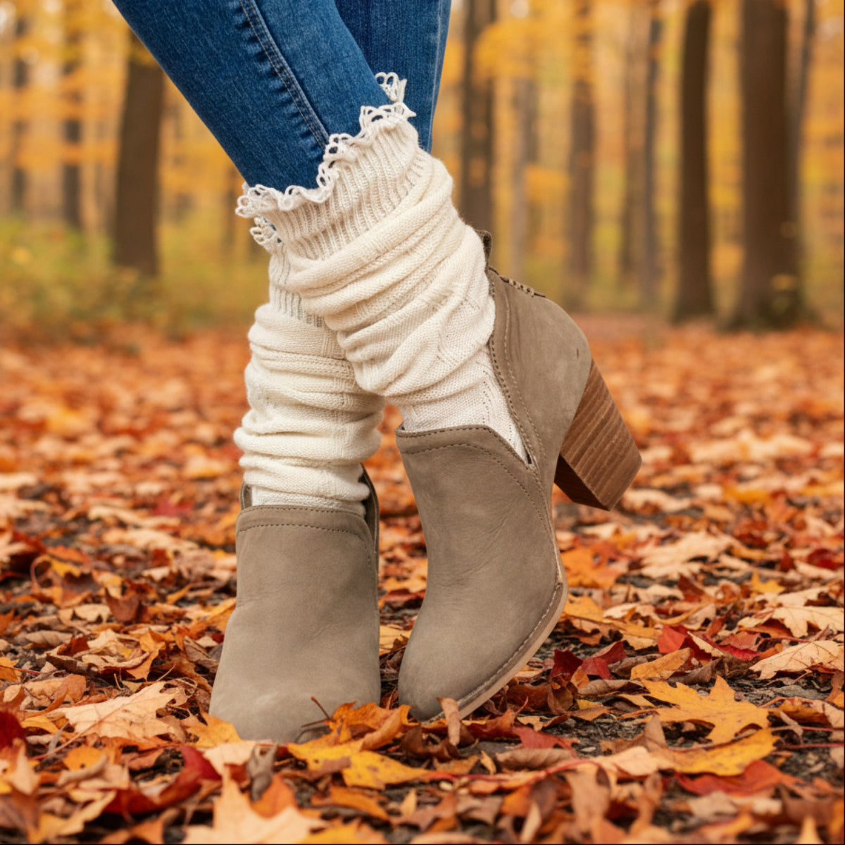 White ribbed socks with lace trim worn with brown ankle boots on a white background, MOUNTAIN lace knee boot socks - natural