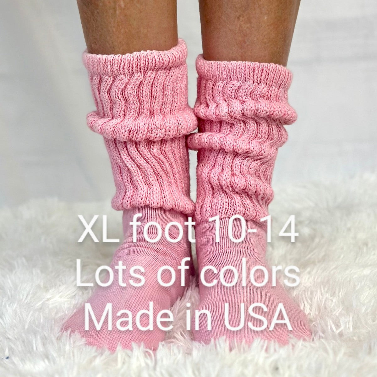 Pink knitted socks on feet with text about size and origin. ULTIMATE XL foot cotton slouch socks unisex -assorted colors 10-14