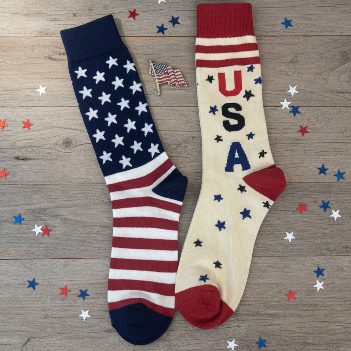Two socks with American flag design on a wooden surface with confetti.