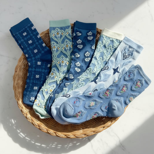 6 pairs of blue socks by Catherine cole