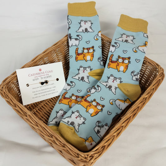 Pair of socks with cartoon cat and tiger design on a white background