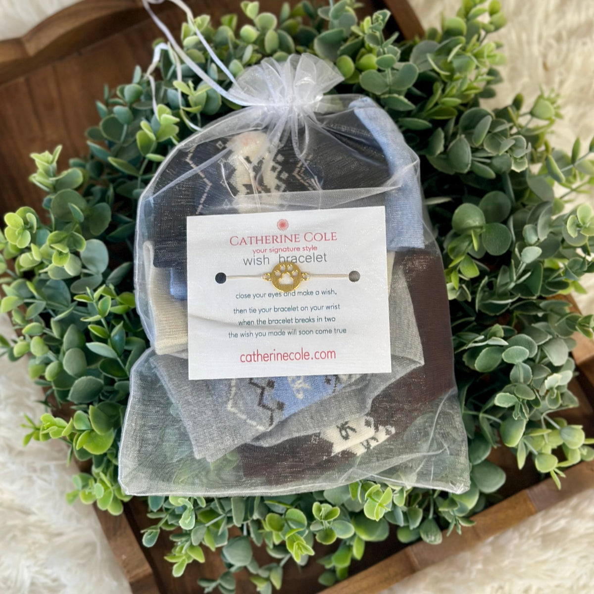 Catherine Cole bracelet packaging on a decorative wreath