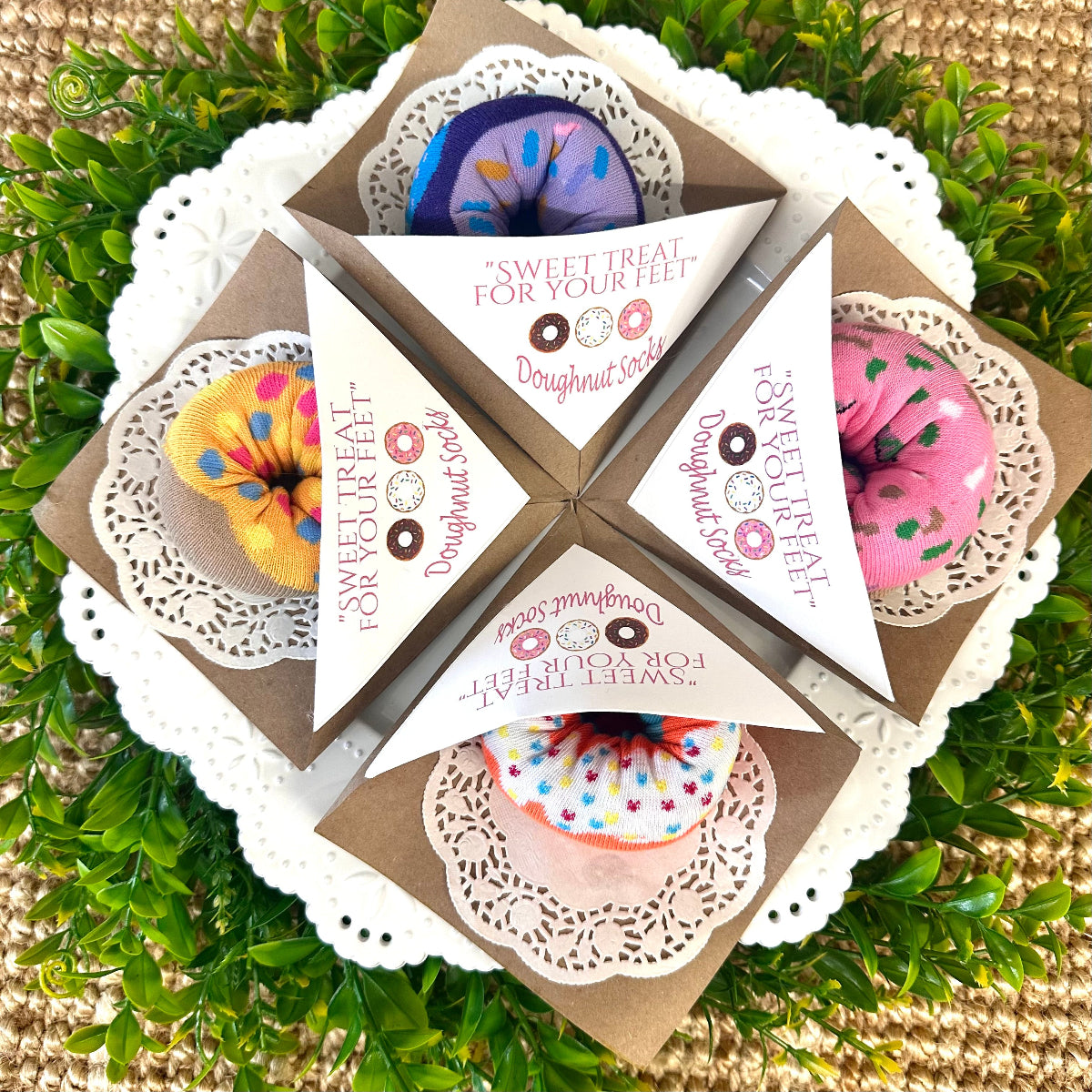 Four doughnut print sock sets in paper sleeves with paper doily – bakery style novelty gift