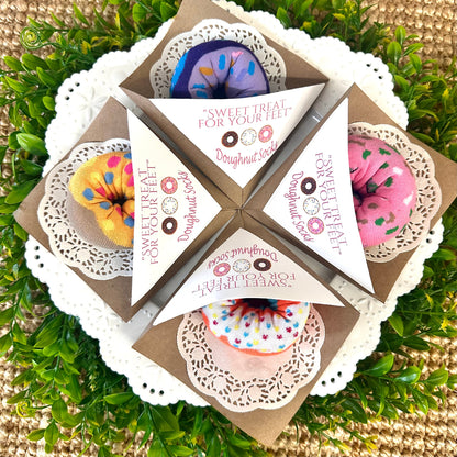Four doughnut print sock sets in paper sleeves with paper doily – bakery style novelty gift
