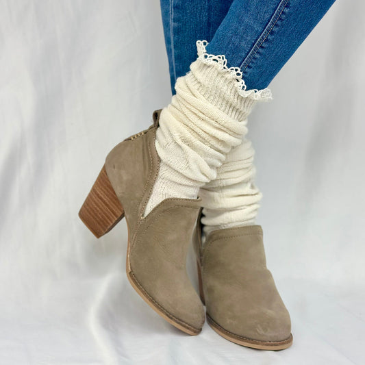 Beige ankle boots with white ribbed socks and lace cuffs on a white - MOUNTAIN  lace  knee boot socks - naturalbackground