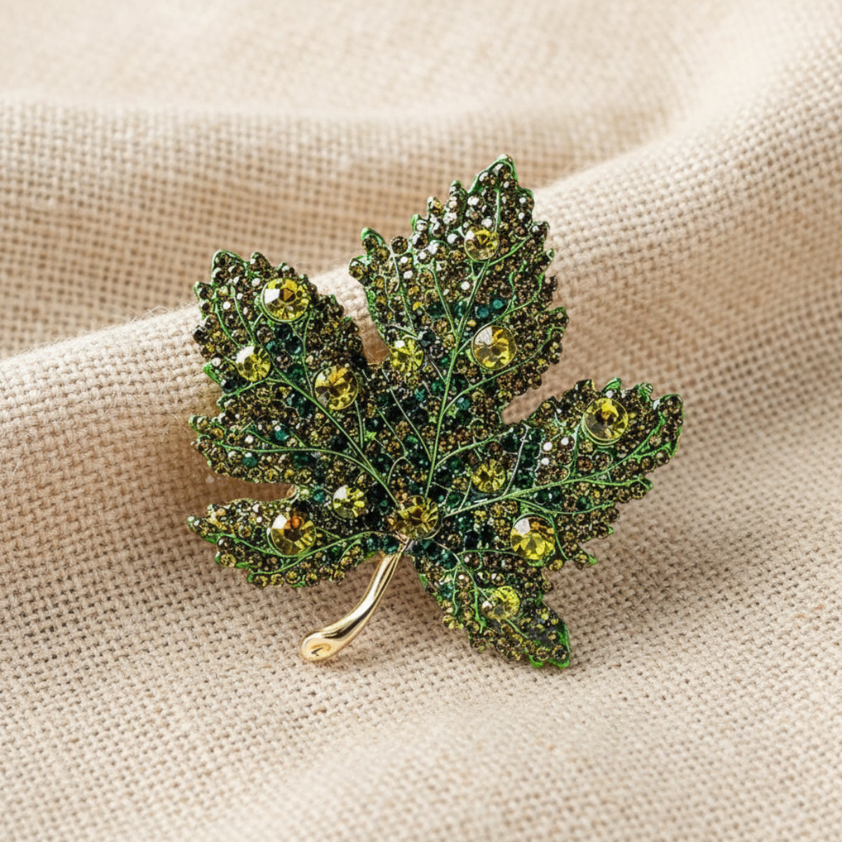 Decorative leaf brooch with gemstones on a white background. Green Maple Leaf Crystal Brooch Pin 2" | Fall Rhinestone Leaf Pin
