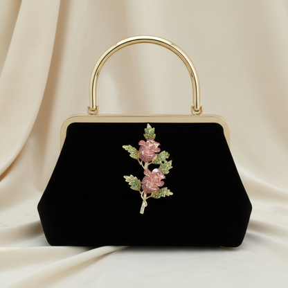 Black handbag with floral embellishments on a beige fabric background,  Pink Double Rose Crystal Brooch Pin 4" | Rhinestone Flower Brooch