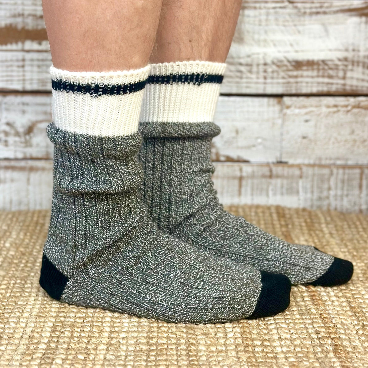 Gray and white socks worn by a person on a woven surface  Striped Marled Slouch Socks Unisex 10-14 - Salt & Pepper