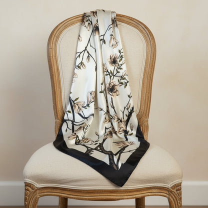 Floral patterned scarf draped over a chair with a neutral background,  The Kyoto | Cherry Blossom Silk-Look Square Scarf 35"