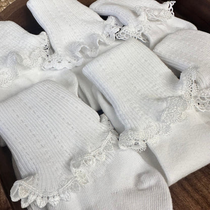 White socks with lace details on a wooden surface. Valued priced 3 pair bundle assorted laces
