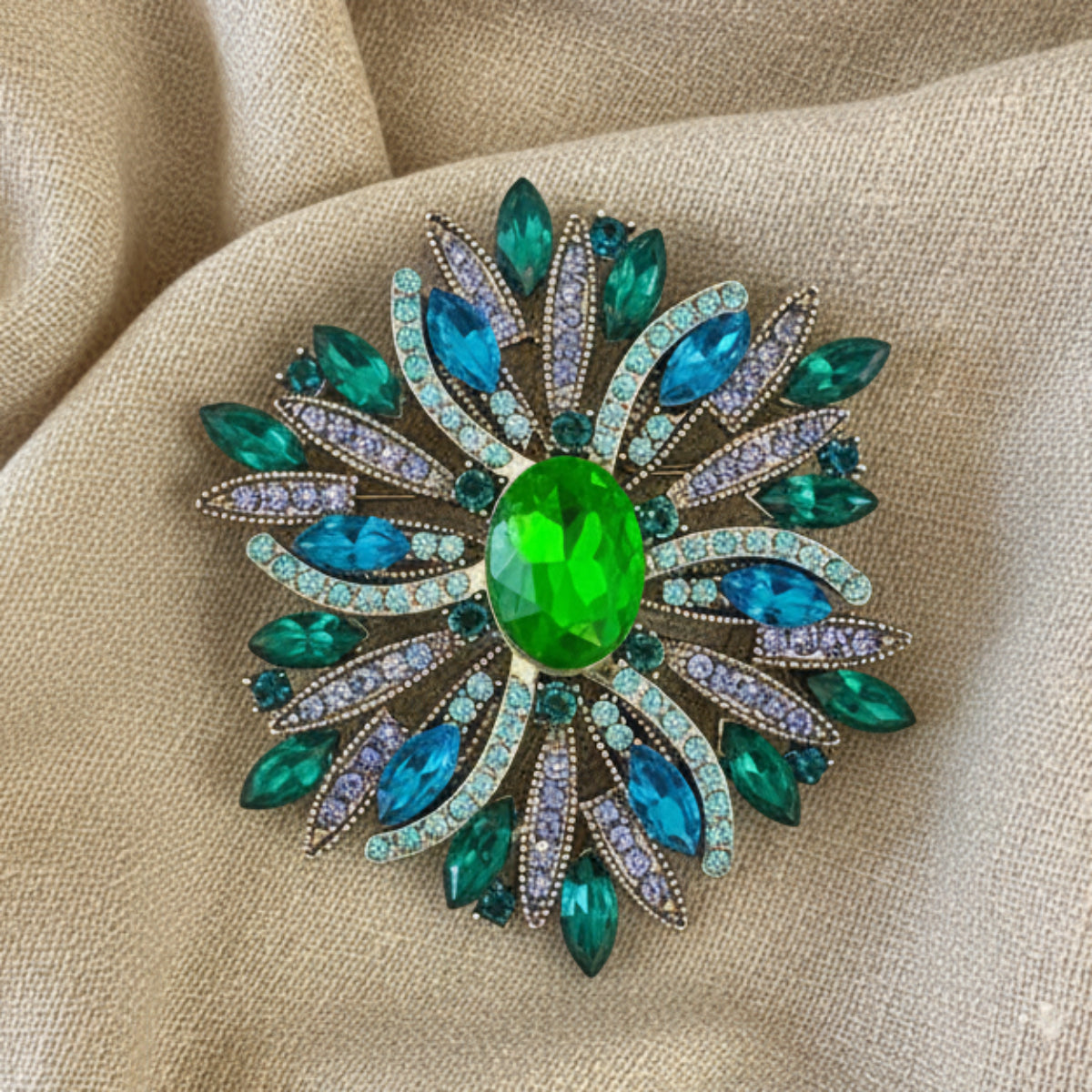 Vintage sunburst brooch in green teal and aqua displayed in frame – Catherine Cole