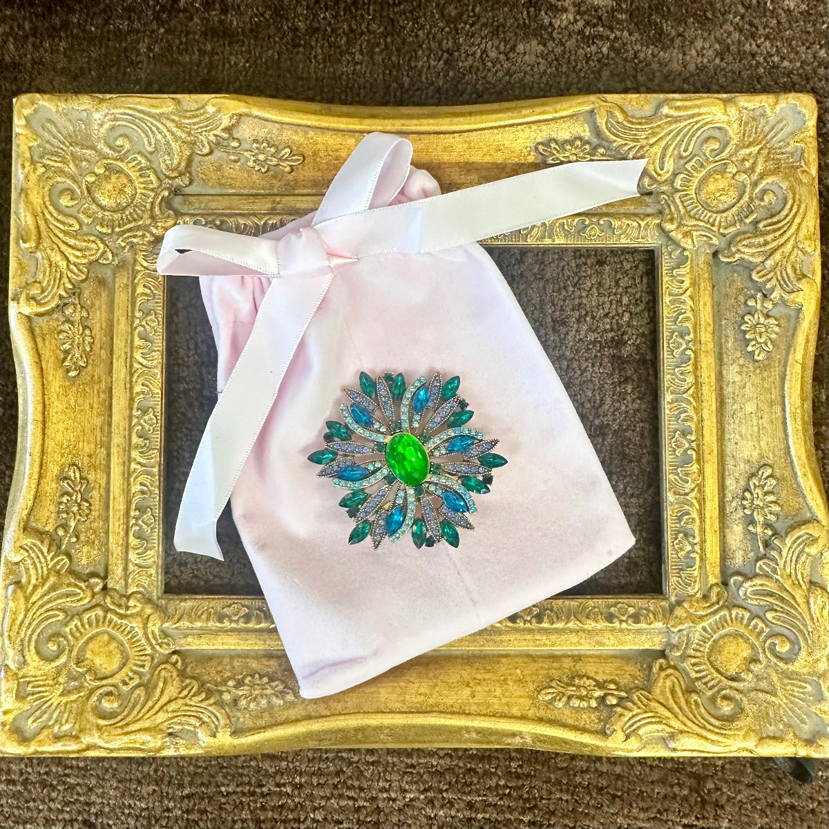 Vintage sunburst brooch on pink velvet gift bag – gift-ready costume jewelry by Catherine Cole