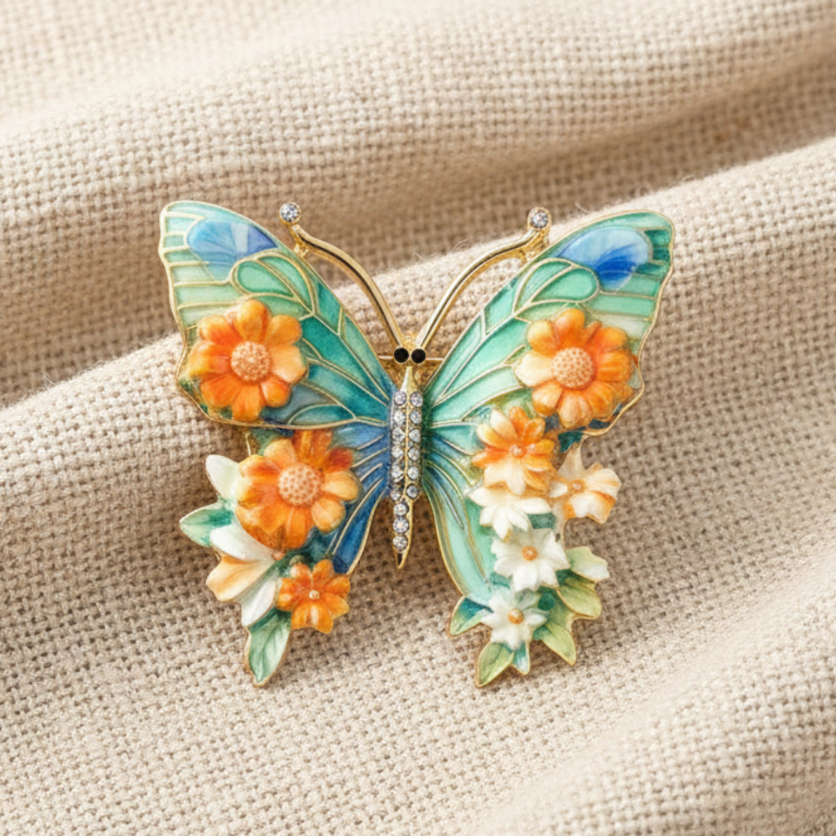 Butterfly-shaped brooch with floral details on a black background