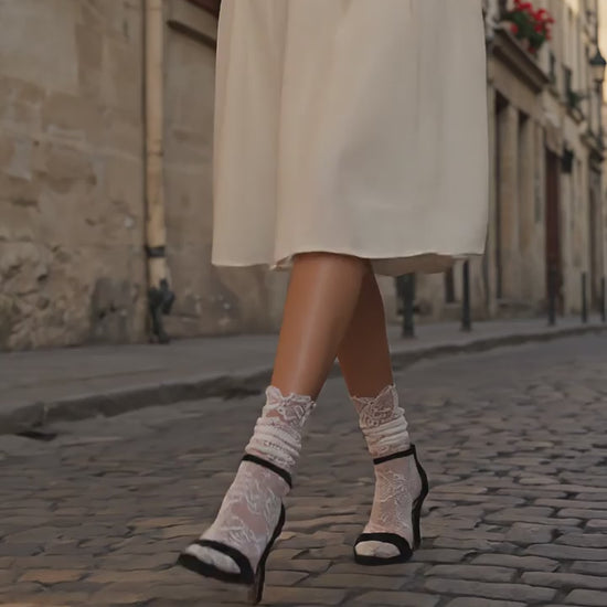 French woman walking in Paris wearing Catherine Cole Allover White Lace Socks on black heels